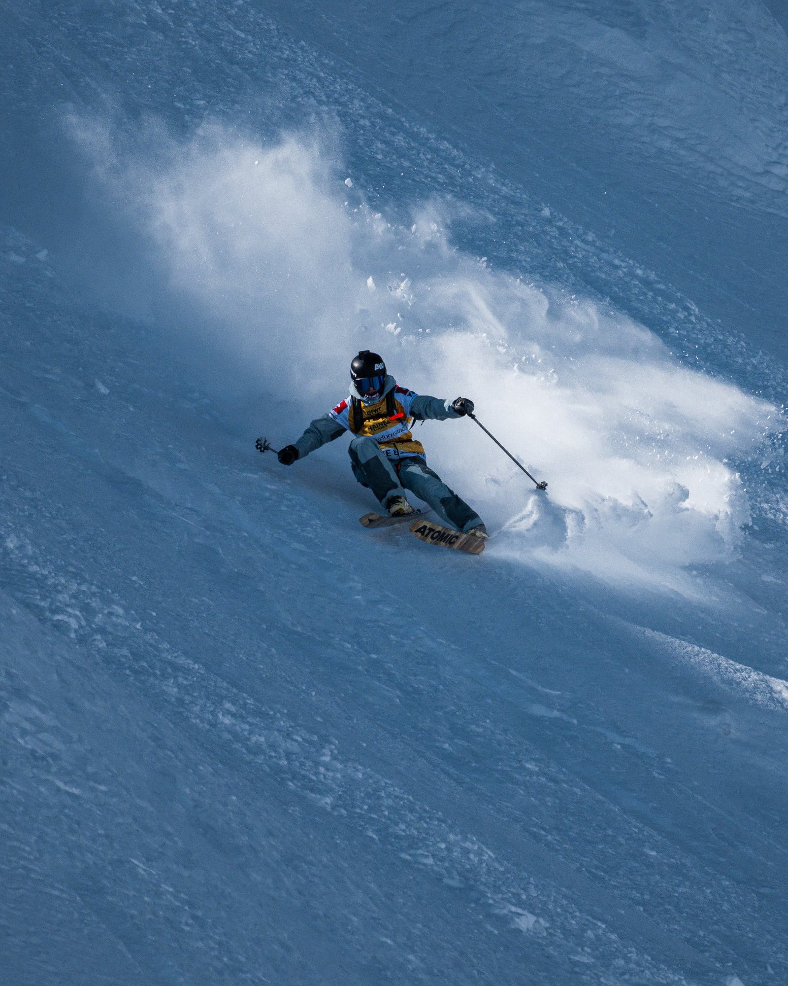 Sybille Blanjean carving through powder on a snowy mountain slope
